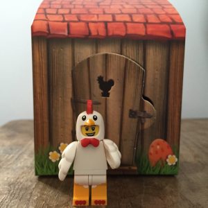 Lego Easter Chicken Man minifigure standing by his house