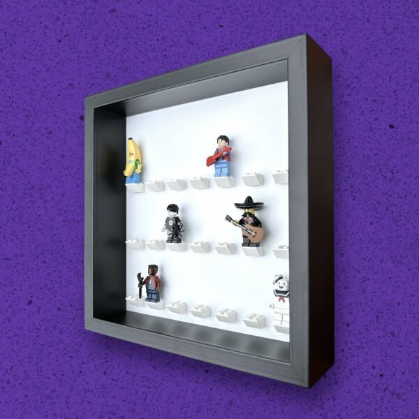 FRAMEPUNK white background display for 21 Lego minifigures, black frame, white bricks, side view, showing minifigures