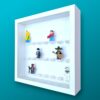 FRAMEPUNK white background display for 21 Lego minifigures, white frame, white bricks, side view, showing minifigures
