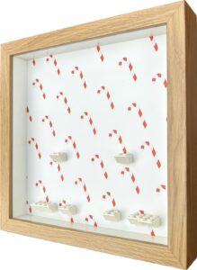 FRAMEPUNK Candy Cane Christmas background and white brick mounts display frame compatible with 6 Lego minifigures - Side view