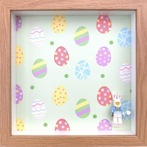 FRAMEPUNK Easter background and white LEGO brick mount display frame compatible with 1 LEGO minifigure - showing Easter Bunny minifigure