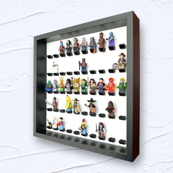 FRAMEPUNK white background display for 50 Lego minifigures, black bricks, black frame, side view, showing minifigures