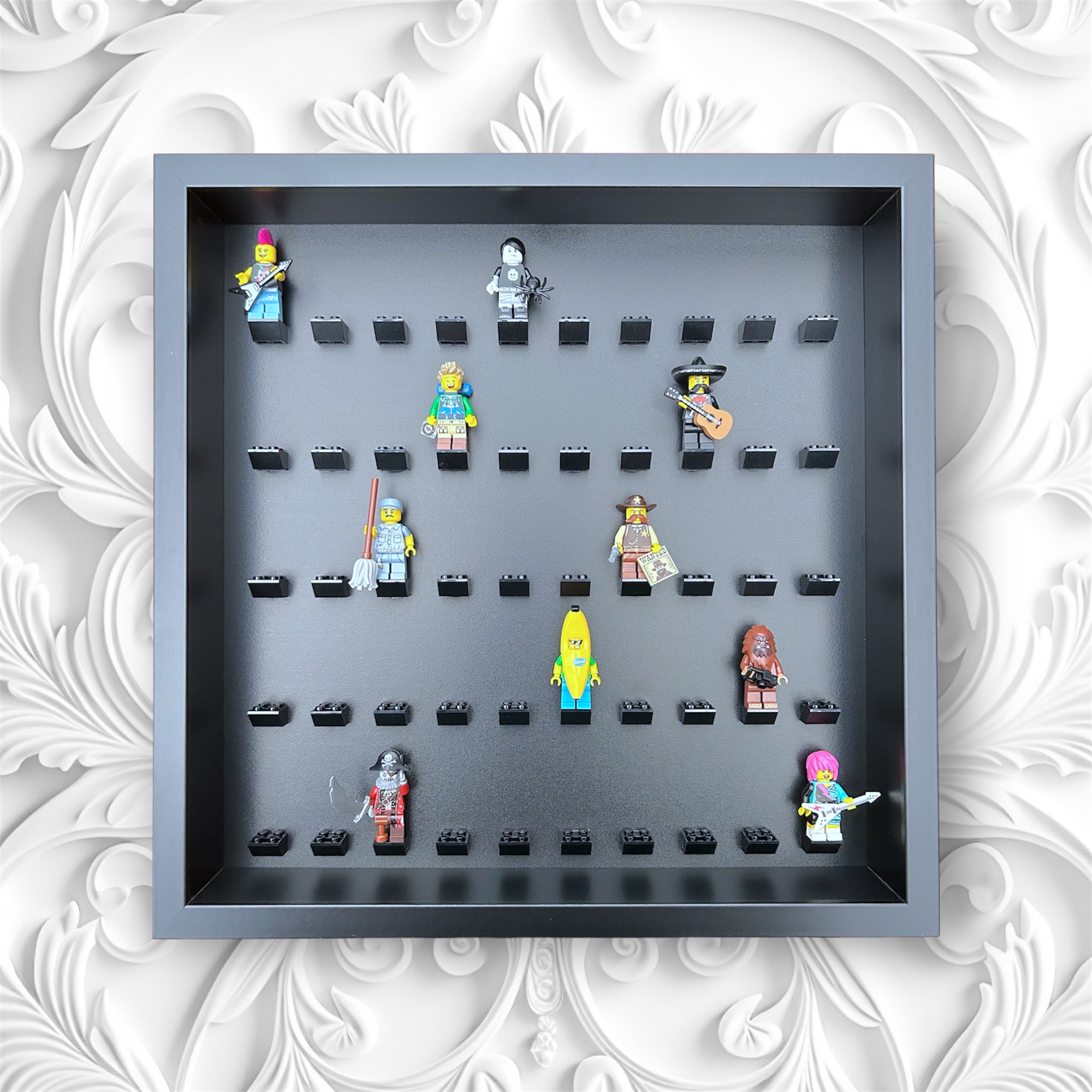 FRAMEPUNK black background and black mounts display frame compatible with 50 Lego minifigures (black) - demonstrating how minifgures look