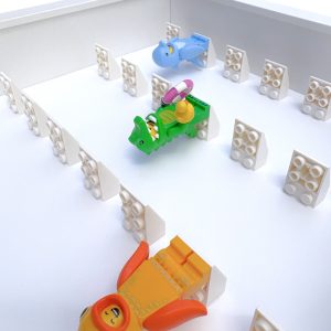 FRAMEPUNK white background and white 2x3 mounts display frame compatible with 21 Lego minifigures (white), showing minifigures, depth view